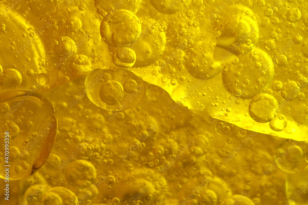 Wall mural close up of oil or fat in transparent glass