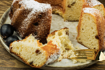 plate with soft cupcake, pieces of cake on a ceramic plate. closeup.