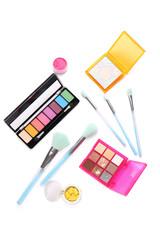 Set of decorative cosmetics with makeup brushes on white background