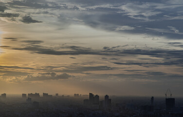 Fototapeta premium Beautiful sunset sky above clouds with dramatic light, Beautiful blazing sunset landscape, Copy space, Selective focus.
