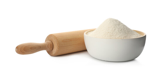 Wooden rolling pin and bowl with flour on white background