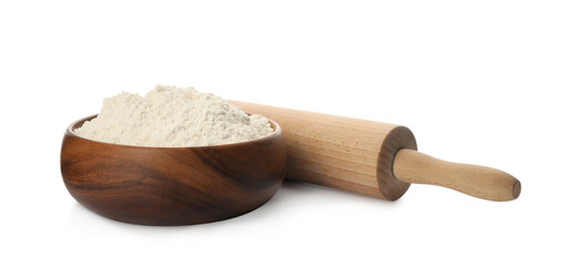 Wooden rolling pin and bowl with flour on white background