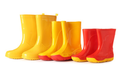 Many different rubber boots on white background