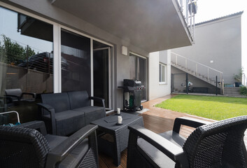 Small garden and terrace of modern apartment