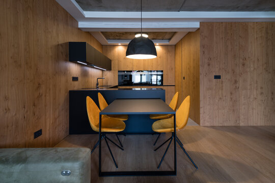 Dining table in kitchen of modern apartment