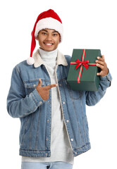 African-American man with Christmas gift on white background