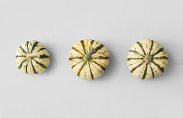 Whole fresh pumpkins on light background