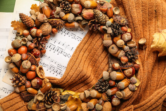 Beautiful acorn wreath, sweater and notes on table
