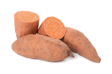 Whole and cut ripe sweet potatoes on white background