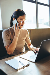 Focused businesswoman working in a modern workspace
