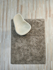 Carpet above, up, top on the parquet, wicker, rocking chair and sofa style, middle table decoration.