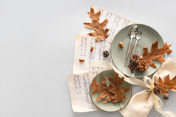 Autumn table setting and music notes on light background