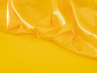 Creative modern Christmas composition with illuminating yellow table against shiny golden curtain....