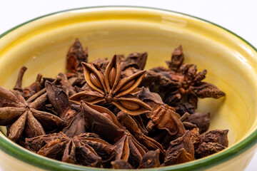 Star anise in a vintage ceramic bowl