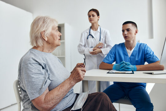 elderly woman at the doctor's and nurse's appointments in the medical office