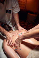 Woman on a massaging, chiropracting table, treatment of body and skin tension.