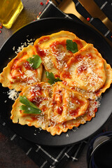 Delicious food concept with ravioli on textured background