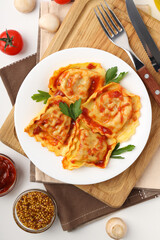 Delicious food concept with ravioli on white background