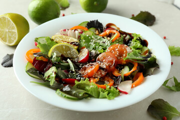 Concept of tasty food with vegetable salad with tahini sauce on light textured background