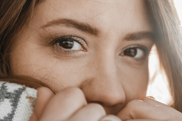 Close up shot of womans eyes at cold weather during winter.