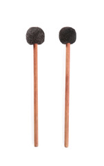 Wooden bass drumsticks on white background, top view