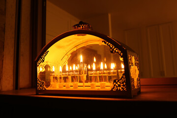 Religion image of jewish holiday Hanukkah background with menorah (traditional candelabra) and oil candles