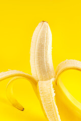 banana on a yellow background close-up shot in the studio