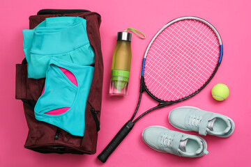 Gym bag and sports equipment on pink background, flat lay