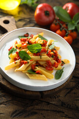 Traditional Italian pasta with tomatoes and basil