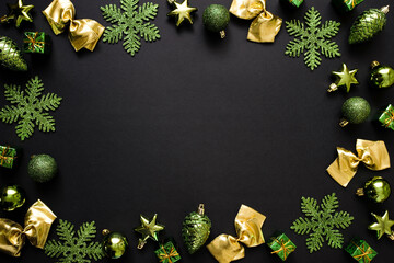 Christmas or New Year background with place for text. Green gift boxes, golden bows, snowflakes and...