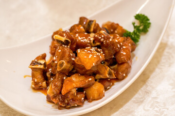 A delicious Chinese dish, pork ribs with sweet and sour orange
