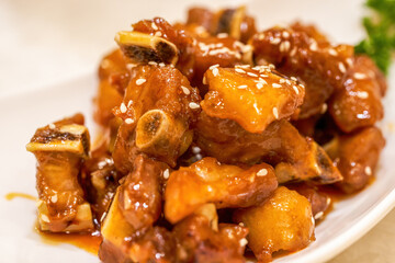 A delicious Chinese dish, pork ribs with sweet and sour orange