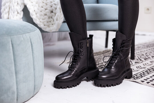 Close up of black womens boots. Fashionable women's stylish leather boots.