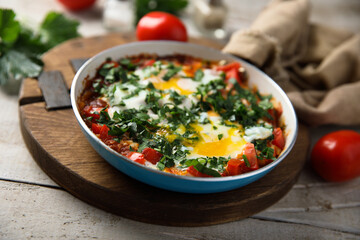 Traditional homemade shakshuka with fresh parsley