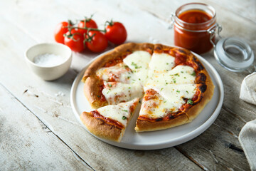 Homemade pizza with mozzarella and tomato sauce	