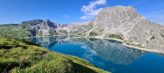 Fototapeta na wymiar Mountains mirroring in Lunersee in the morning, Austrian Alps