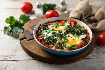 Traditional homemade shakshuka with fresh parsley
