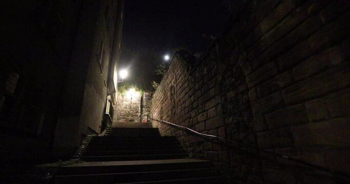 Dark stairs leading to castle in Edinburgh at night can be dangerous if you're alone or not paying attention. Night streets of Scottish capital, Edinburgh, would make a great setting for horror movie