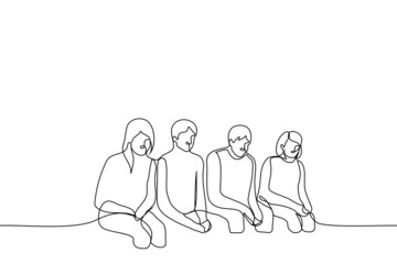group of young men and women guiltily sitting in a row with their heads bowed - one line drawing vector. the concept of obedience, submission, guilty students, failed group work