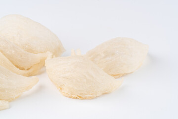 Top Grade edible bird nest shoot on white background with negative space. Raw edible bird's nest materials for tradition chinese medicine. Swallow nest the traditional chinese delicacy.