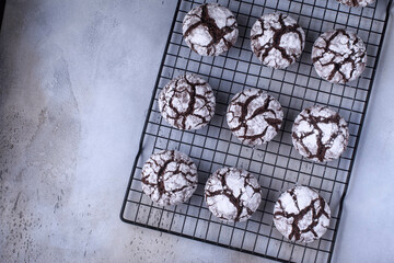 Chocolate crinkle cookies with icing. Homemade chocolate christmas crinkle cookies. Selective focus. 