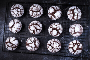 Chocolate crinkle cookies with icing. Homemade chocolate christmas crinkle cookies. Selective focus. 