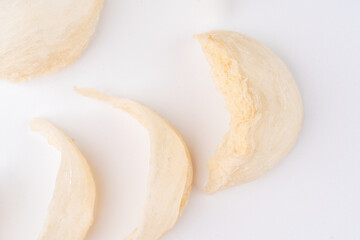 Top Grade edible bird nest shoot on white background with negative space. Raw edible bird's nest materials for tradition chinese medicine. Swallow nest the traditional chinese delicacy.