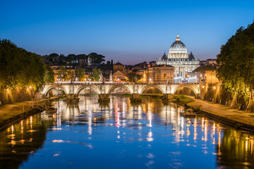 Fototapeta na wymiar Rome skyline at night with view of St. Peter's Basilica and Tiber River 