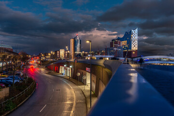 Blue hour in the port of Hamburg with the illuminated Elbphilharmonie