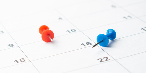 Thumbtack in calendar concept for busy, appointment and meeting reminder