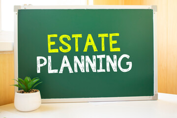 Estate Planning in chalk on the school board, Search engine optimization and websites. Desk, swept balls of paper, computer keyboard
