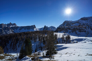 snowed landscape on a sunny day in the dolomites mountains