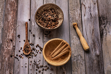 Sweet and savory ingredients ready to be crushed with a wooden mortar