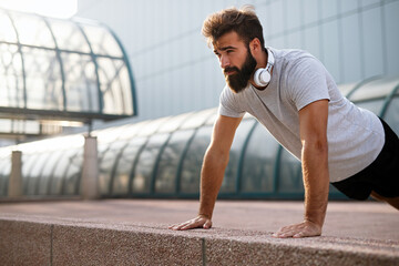 Fototapeta premium Happy young fit man exercising and enjoying healthy lifestyle. Sport people running concept